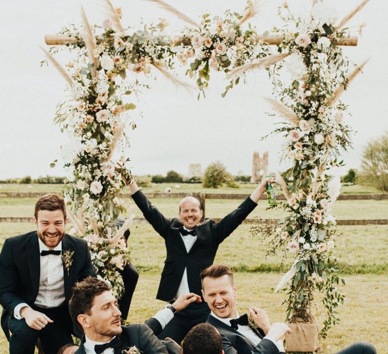 Groomsmen Having Fun in Their Black Tie Suits