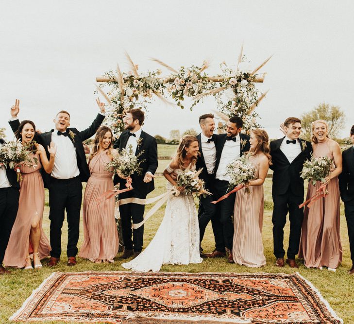 Wedding Party Portrait with Groomsmen in Tuxedos, Bride in Rue de Seine Wedding Dress and Bridesmaids in Pink ASOS Dresses