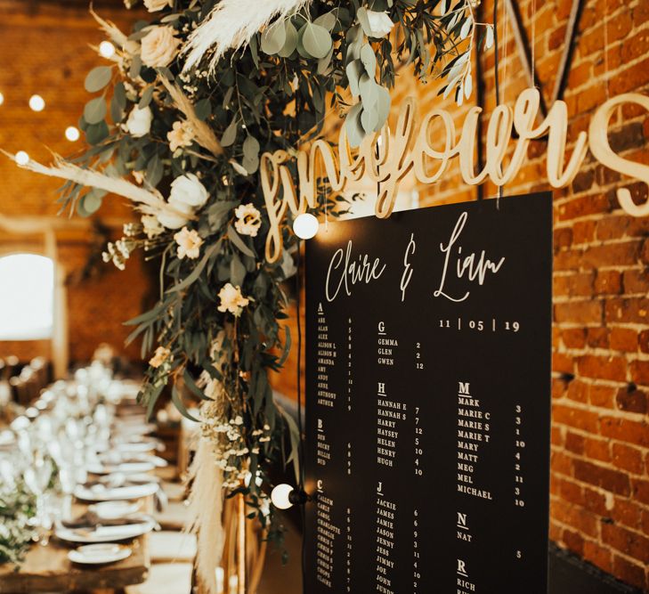 Hanging Seating Chart in Rustic Barn Reception