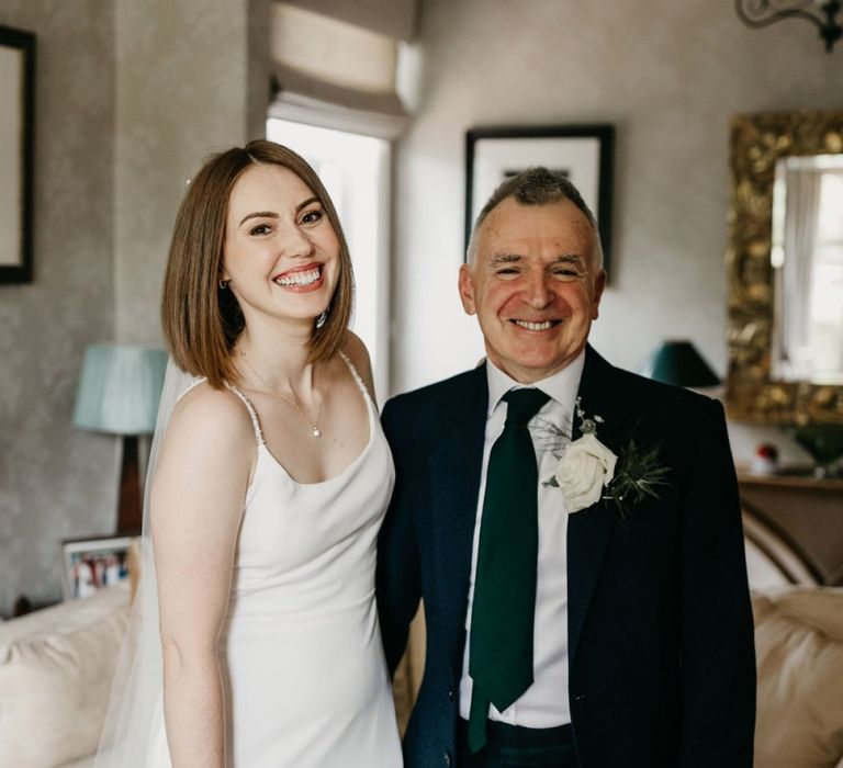 Father of the bride and daughter on the wedding morning