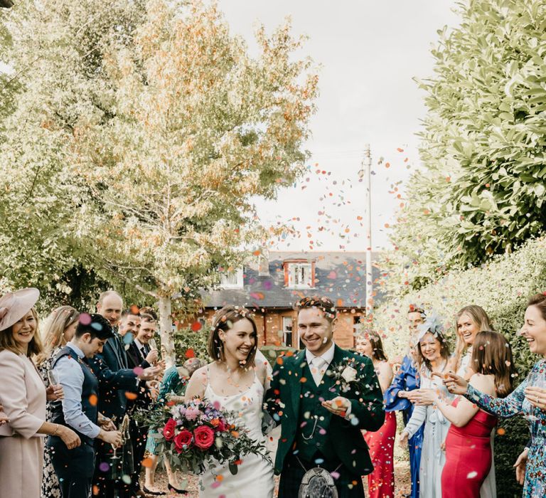 Bride and groom confetti exit