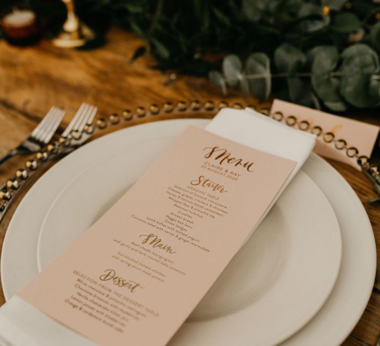 Blush pink menu card at place setting