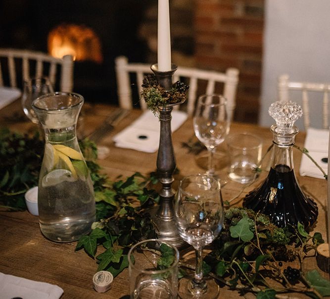 Table plan styling at gothic wedding with candlelights and foliage decor