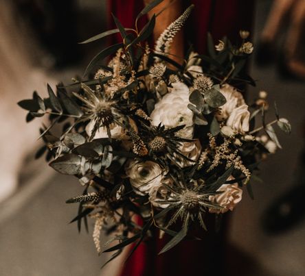 Pew End of White Flowers, Green Foliage and Thistles Tied with Maroon Ribbon | Festoon Light Canopy and Indoor Trees for Humanist Wedding in St Andrews | Carla Blain Photography