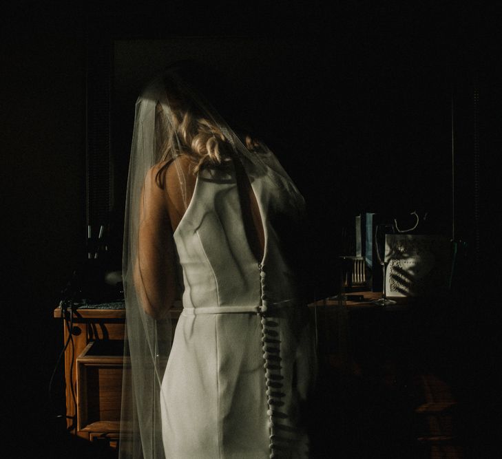 Bride in Anne Priscilla Signature Gown with Halterneck, Keyhole Back and Belt | Floor Length Veil | Festoon Light Canopy and Indoor Trees for Humanist Wedding in St Andrews | Carla Blain Photography