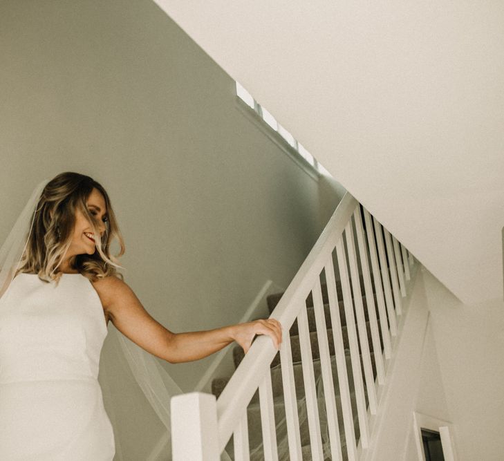 Bride in Anne Priscilla Signature Gown with Halterneck, Keyhole Back and Belt | Floor Length Veil | Festoon Light Canopy and Indoor Trees for Humanist Wedding in St Andrews | Carla Blain Photography