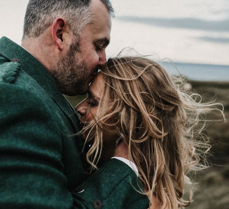 Bride in Anne Priscilla Signature Gown with Halterneck, Keyhole Back and Belt | Groom in Mackintosh Tartan Red and Black Kilt with Green Jacket and Waistcoat | Festoon Light Canopy and Indoor Trees for Humanist Wedding in St Andrews | Carla Blain Photography