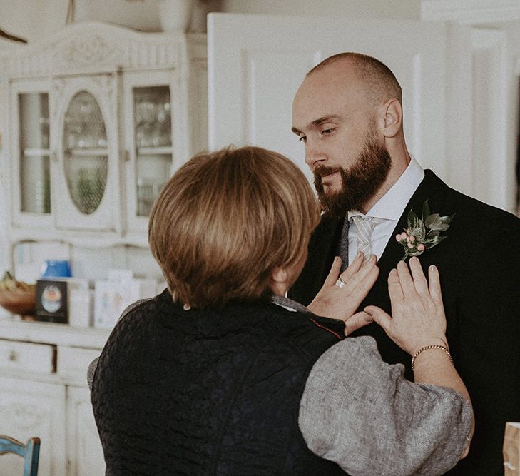 Groom Wedding Preparations Attaching Floral Button Hole