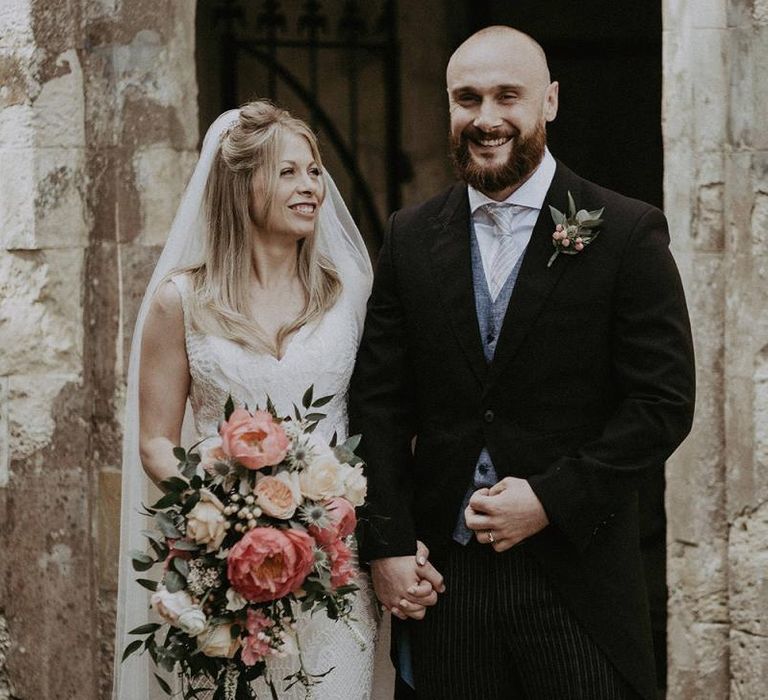 Bride and Groom After Ceremony with Peony Wedding Bouquet