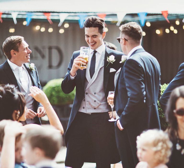 Pre-Ceremony Pint | Groom in Navy Tails and Grey Waistcoat | Lace Bridal Cape Veil &amp; Fishtail Wedding Dress by Pronovias | On Love and Photography