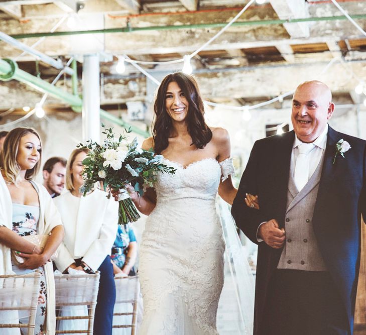 Entrance of the Bride | Bride in Embroidered Pronovias Wedding Dress with Off Shoulder Sleeves and Veil Cape | Bridal Bouquet of White Roses and Greenery | Father of the Bride in Navy Tails, Grey Waistcoat and White Tie | Bride Wearing Hair Down | Lace Bridal Cape Veil &amp; Fishtail Wedding Dress by Pronovias | On Love and Photography