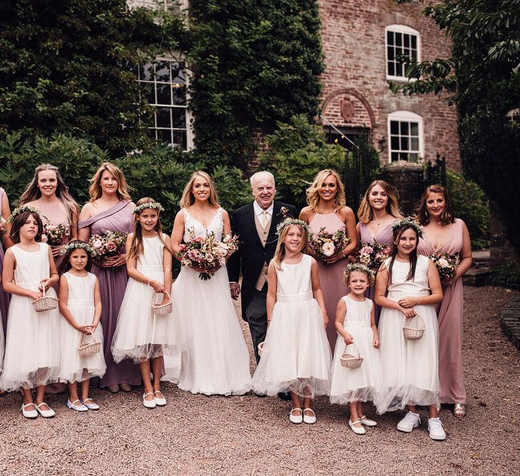 Bride with bridesmaids and flower girls