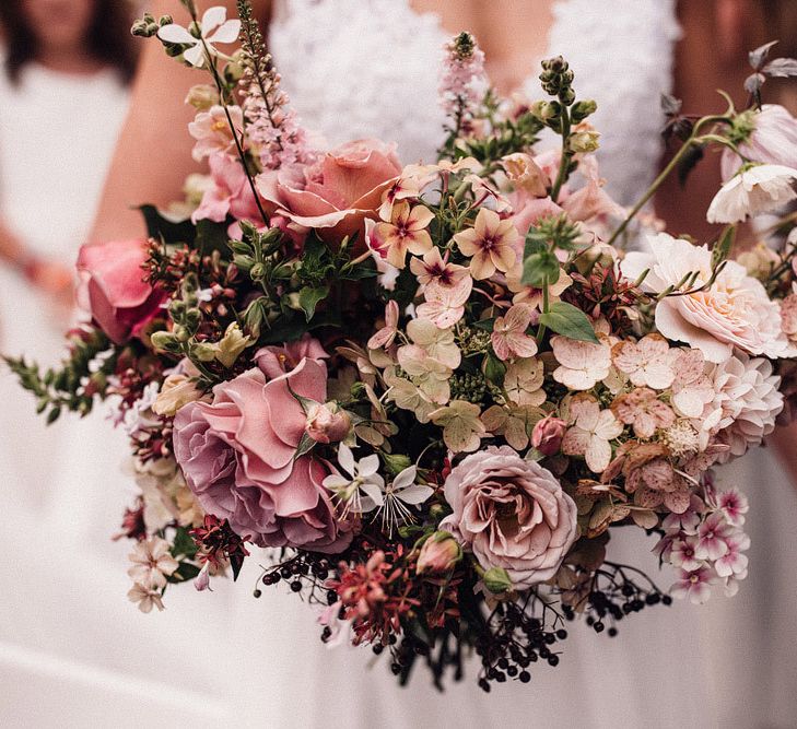 Blush bouquet for bride at Dewsall Court wedding