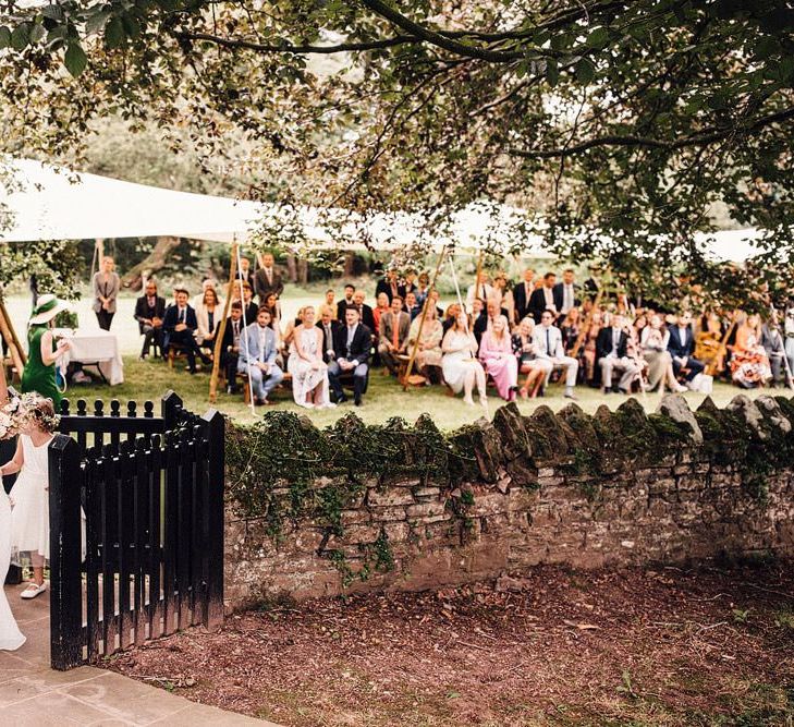 Bride makes her way to small church ceremony