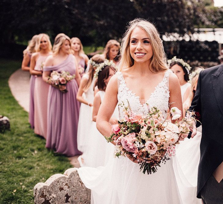 Bride at Dewsall Court wedding in lace bride dress