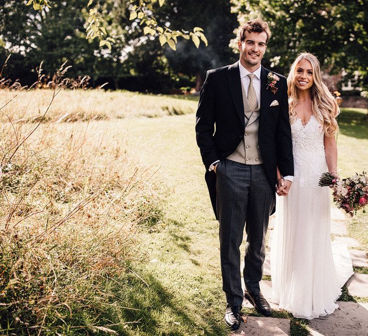 Groom in classic wedding suit with tails