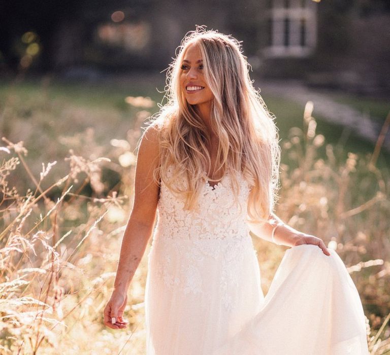 Bride wearing lace Donatella Piccarreta wedding dress