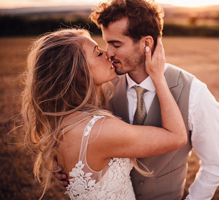 Bride and groom kiss