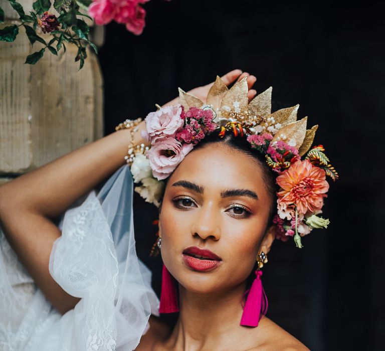 Beautiful black bride with colourful flower crown and tassel earrings