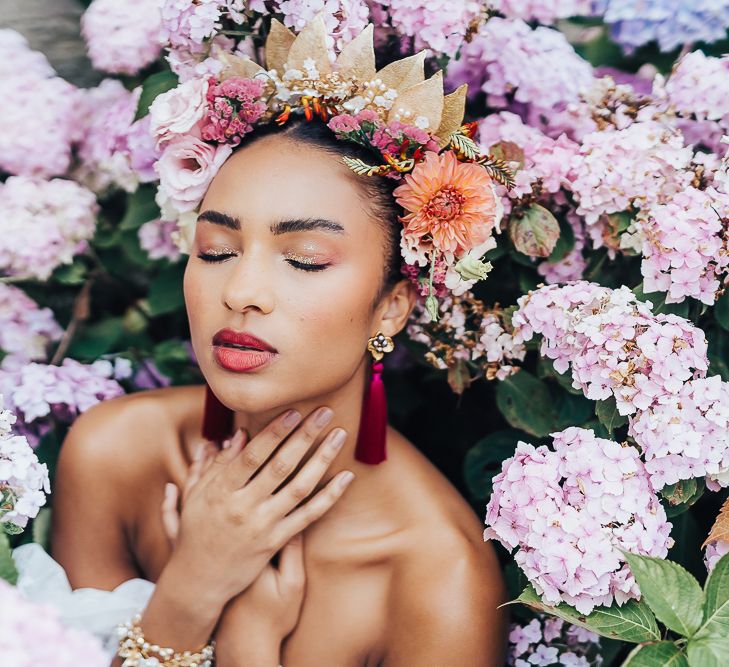 bride with pink tassel earrings and gold highlighter eyeshadow