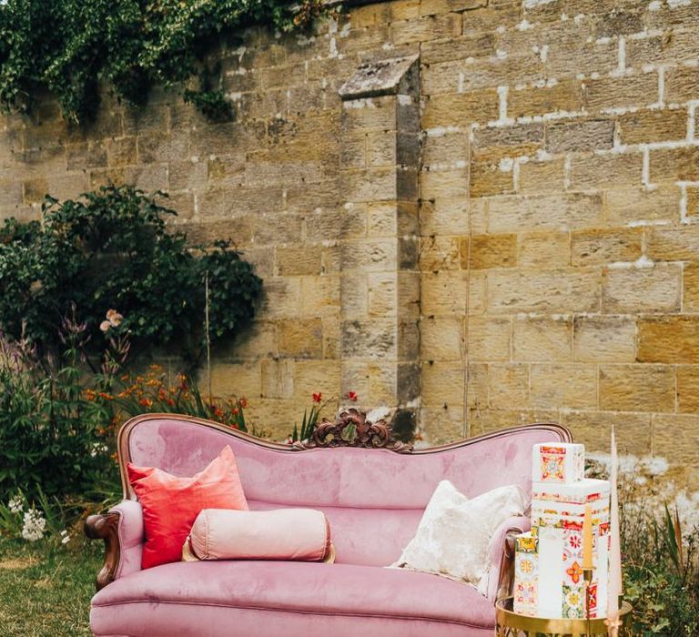 Pink velvet couch chill out area