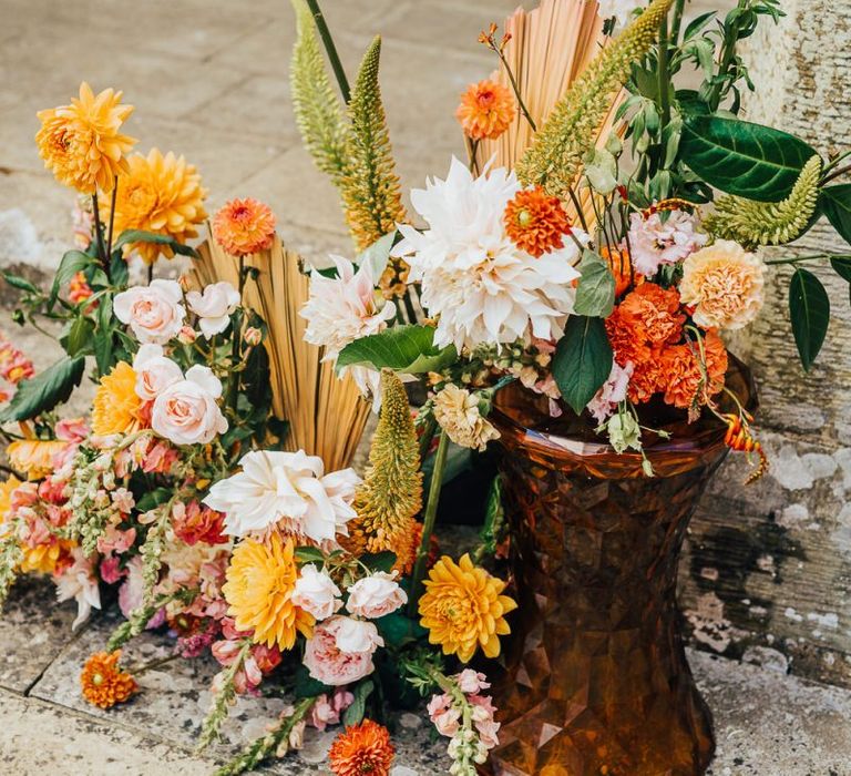 Orange, yellow and green flower arrangement at Chiddingstone Castle