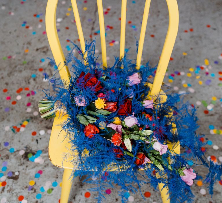 Blue and red wedding bouquet for colourful wedding theme