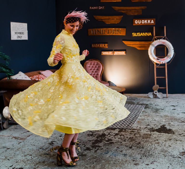 Bride in yellow wedding dress for colourful wedding theme