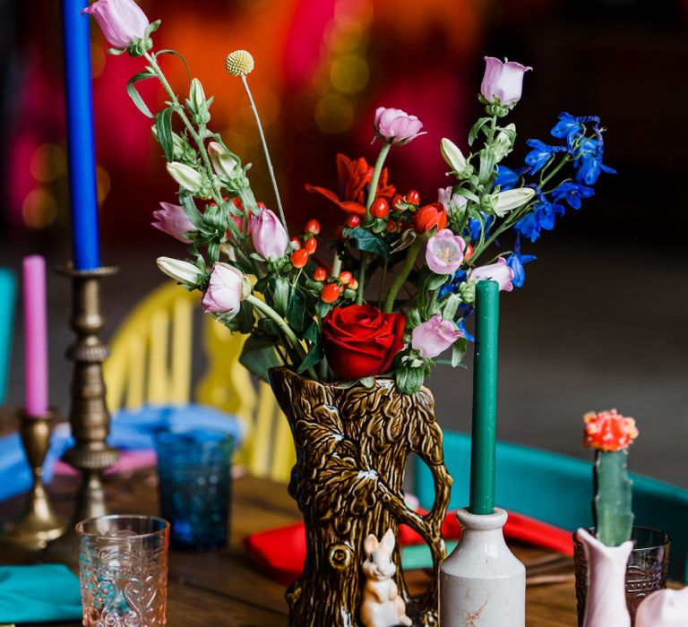 Flower stems in ornate vase for colourful wedding theme