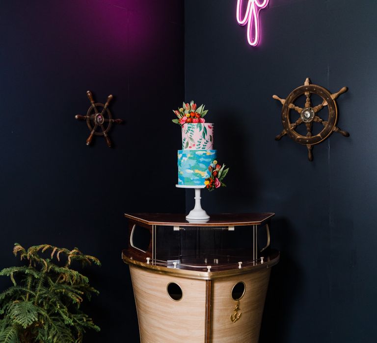 Colourful wedding cake on boat bar