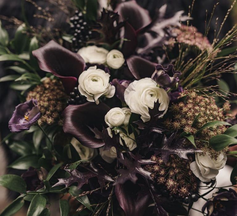 Black calla lily and white ranunculus wedding bouquet