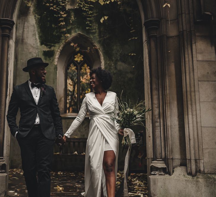 Stylish bride and groom at St Dunstan in the East