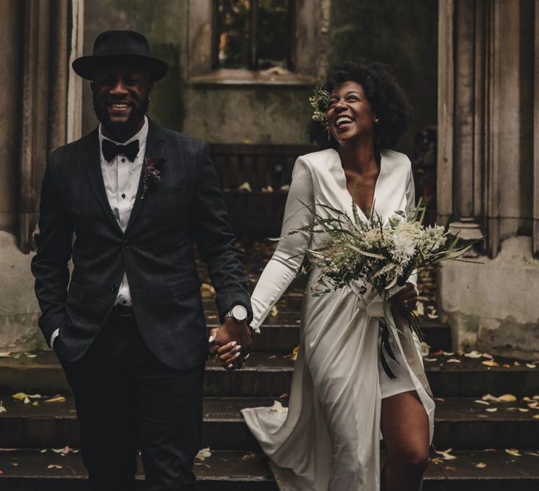 Happy bride and groom in black tie attire for London wedding