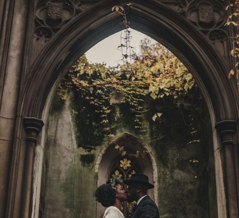 Bride and groom embracing at St Dunstan in the East