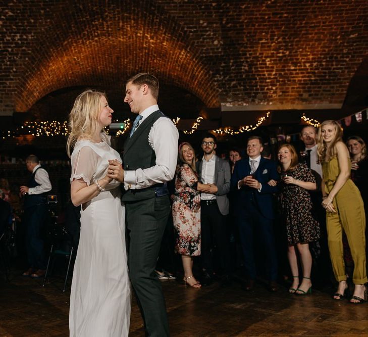 Bride and grooms first dance and  colourful reception with bright and fun decor in London