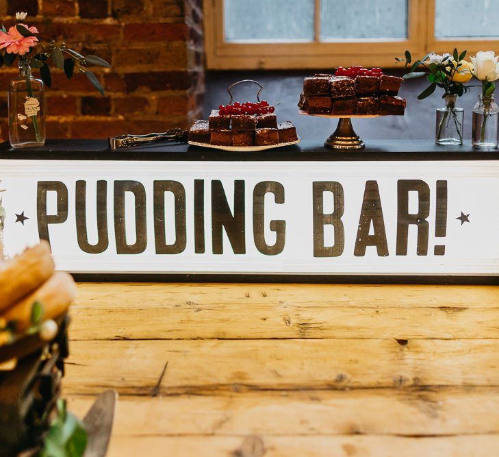 Pudding bar sign at bright and colourful kitsch wedding