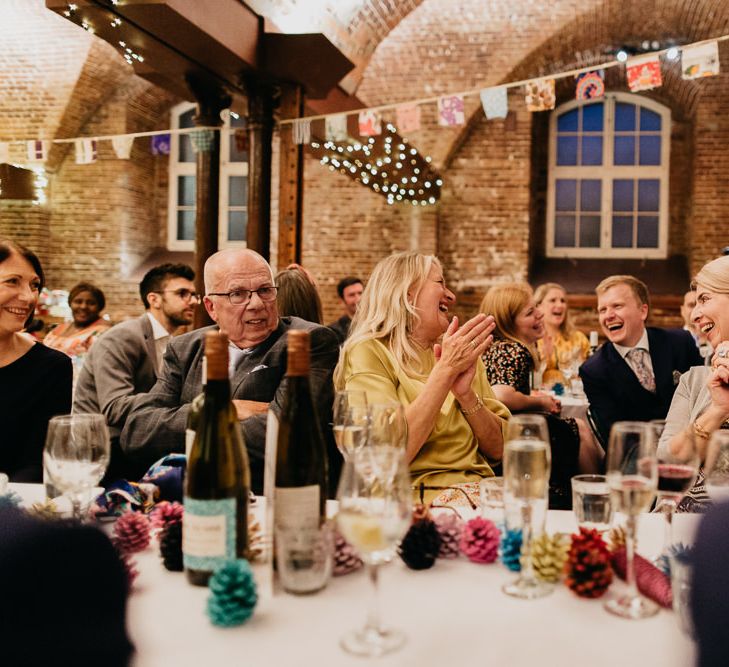 Hand painted pine cone wedding decor and homemade bunting from vintage scarves