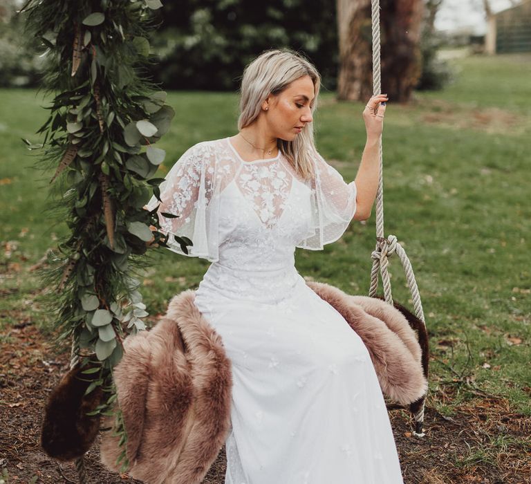 Boho Bride in ASOS Dress | Faux Fur Coverup | Greenery Swing Garland | Country Boho Inspiration in the Woodlands of Happy Valley Norfolk | Cara Zagni Photography