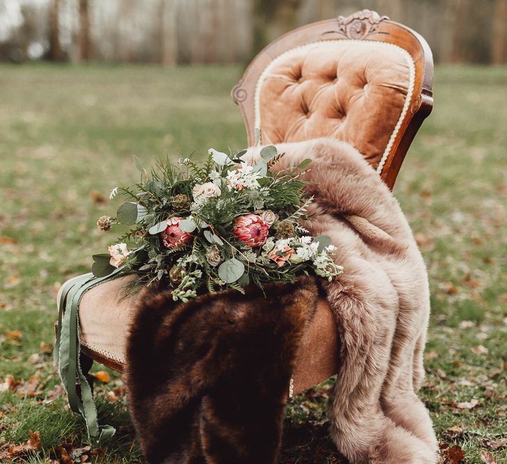 Foliage, Coral Flowers &amp; Pheasant Feather Bouquet | Country Boho Inspiration in the Woodlands of Happy Valley Norfolk | Cara Zagni Photography