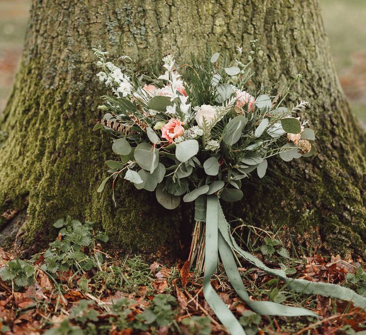 Foliage, Coral Flowers &amp; Pheasant Feather Bouquet | Country Boho Inspiration in the Woodlands of Happy Valley Norfolk | Cara Zagni Photography