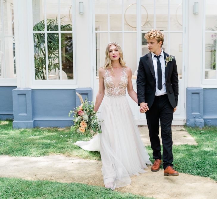 Bride in Watters Wedding Dress with Beaded Bodice and Tulle Skirt