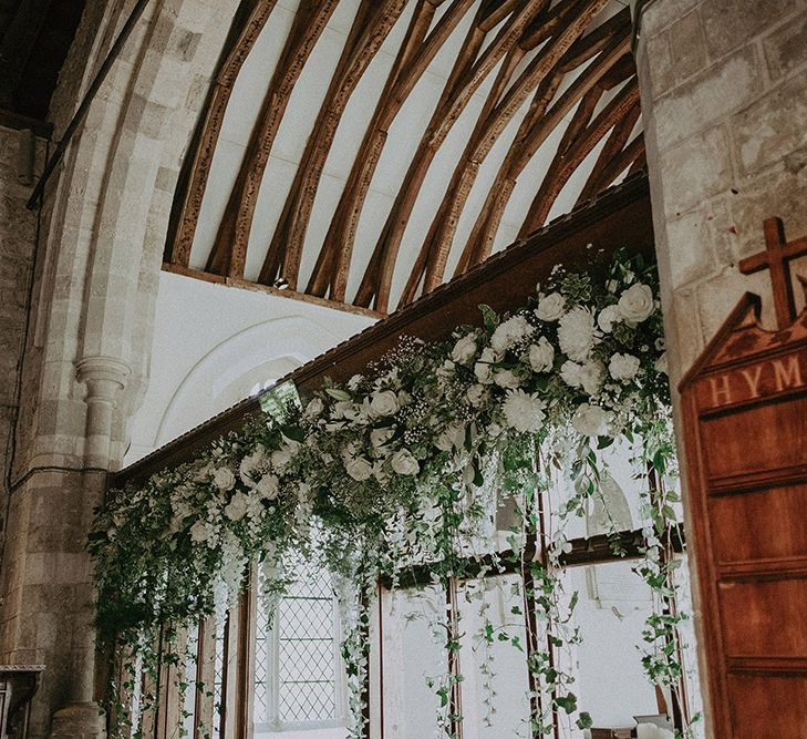 White and Green Church Wedding Flowers at the Altar