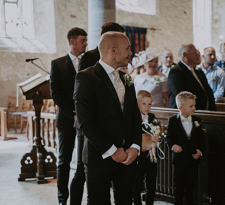 Groom Waiting at the Altar as His Bride Enters the Church Wedding Ceremony