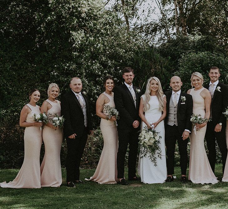 Wedding Party with Bridesmaids in Blush Pink Dresses, Bride in St Patrick Wedding Dress and Groomsmen in Dark Suits