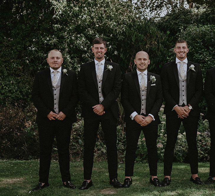 Groomsmen in Dark Suits and Loafers