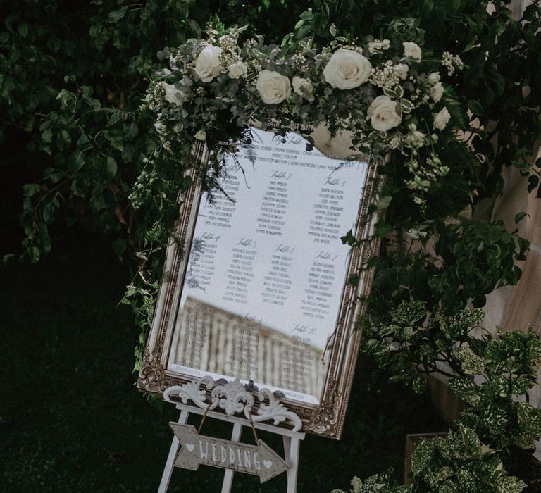 Ornate Mirror Table Plan with White and Green Wedding Flower Decor