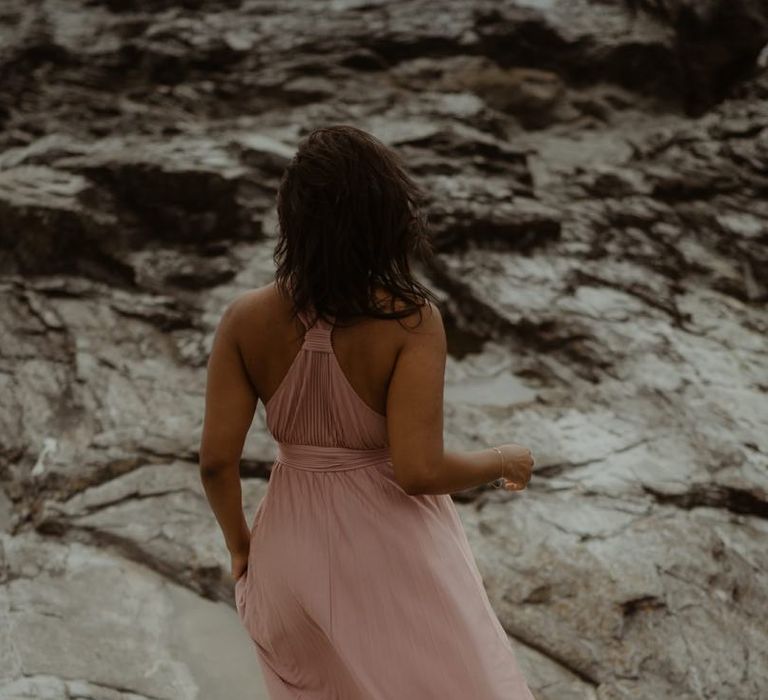 Bride-to-be in a pink maxi dress for engagement session