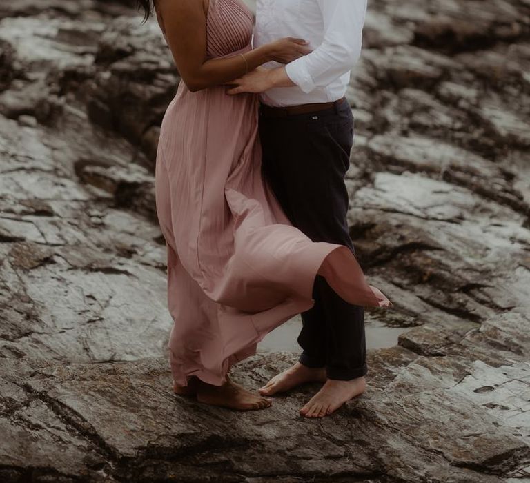 Bride-to-be in a pink dress for a coastal engagement session