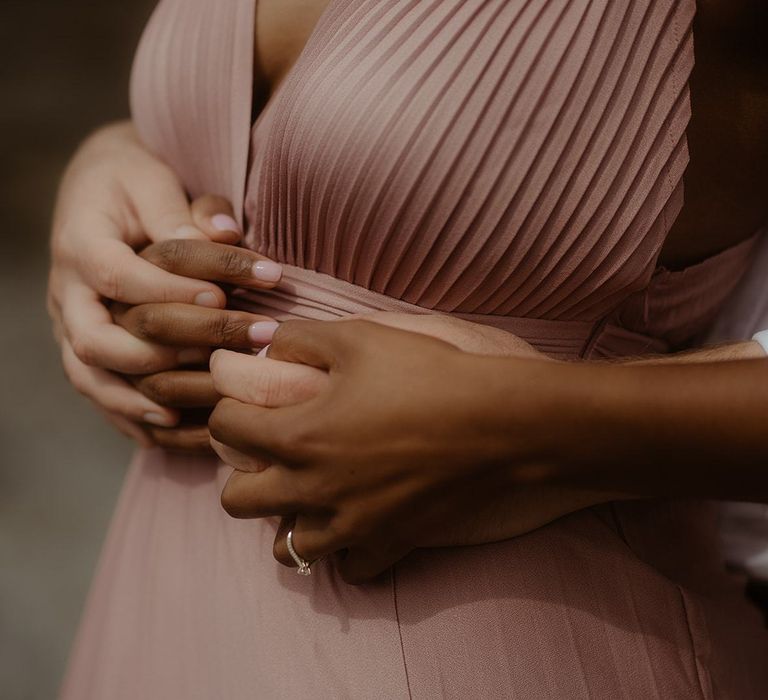 Bride and groom to be holding hands at engagement session