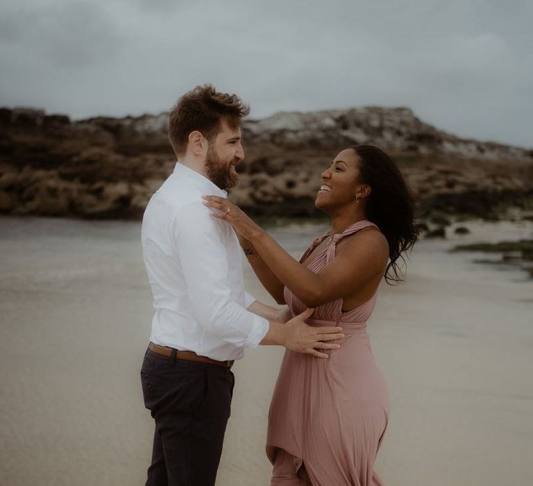 Emotive engagement session on the beach